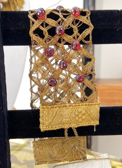 Gold cuff with faceted red garnet bracelet
