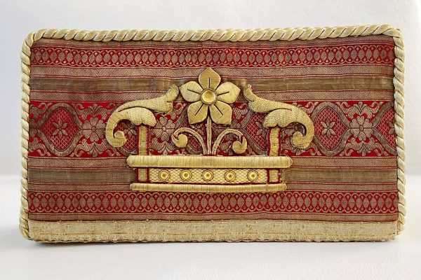 Special red sari clutch with crown applique